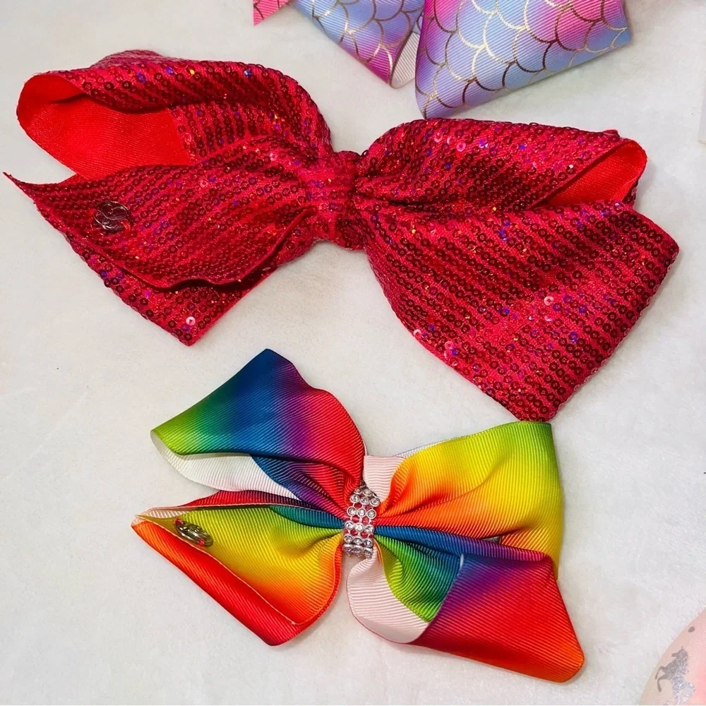 7 Cheerleader/Dance Bows Different Sizes, Colors & Holders. Missing Black Bow